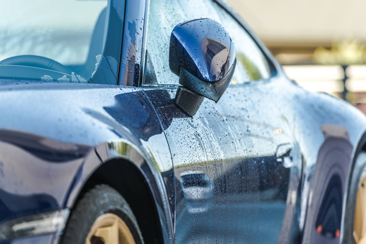 Car Wash Theme. Automotive Industry. Clean, Blue and Modern Luxury Car Right After Washing. Side View.