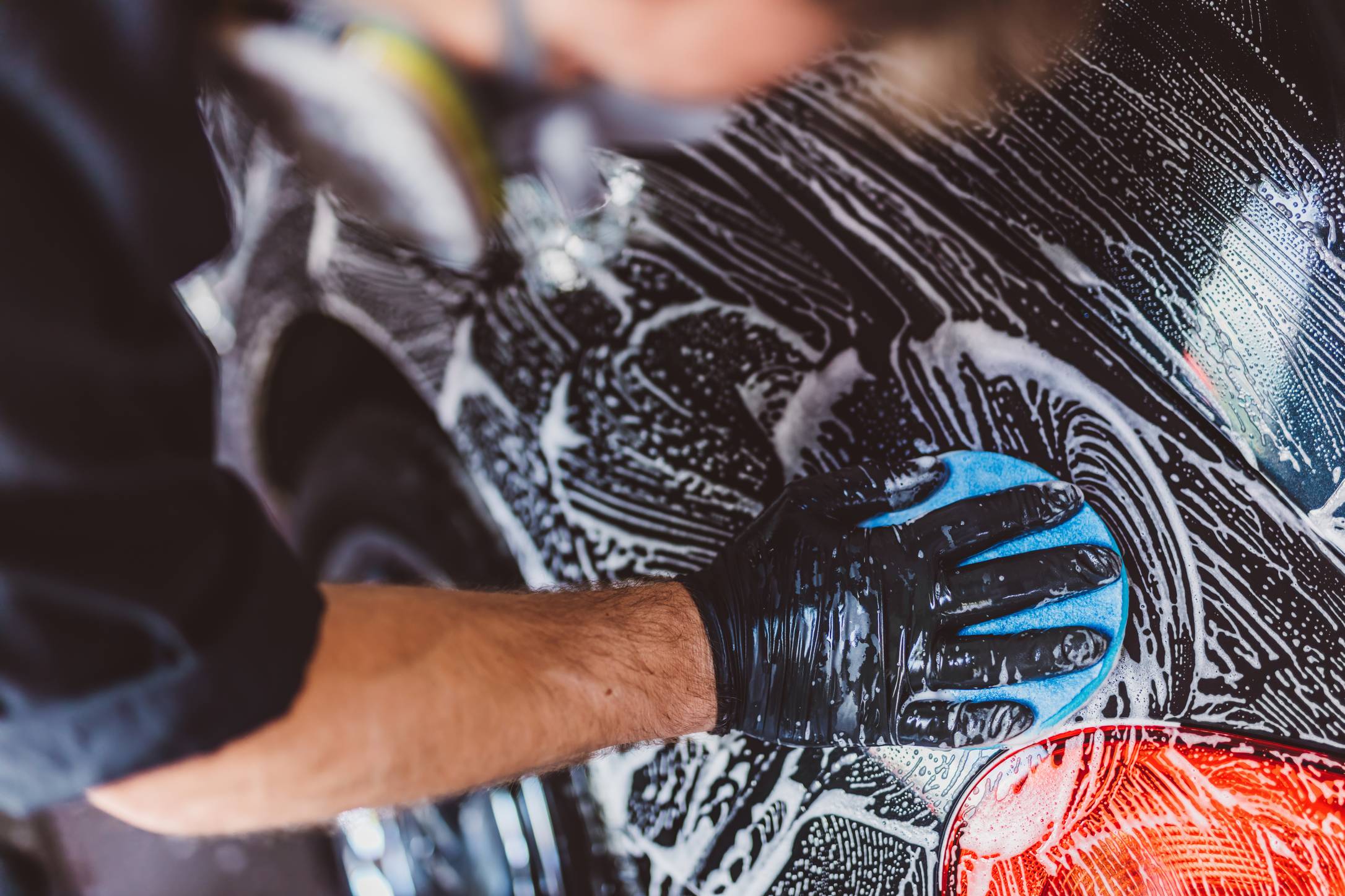 Washing car before detailing in workshop. Professional work